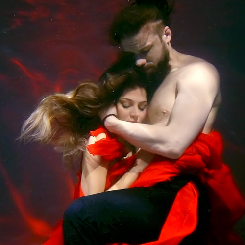 image of man holding a woman close